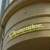 Yellow storefront sign with the word "Clementine" in curved, white letters on a rounded facade.